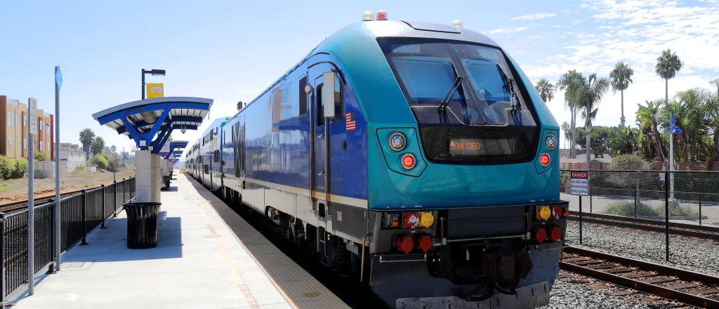 PROMO HIRES Transportation Train Light Rail - Laser1987 iStock-1429700908 Light rail passenger train stopped at a station platform