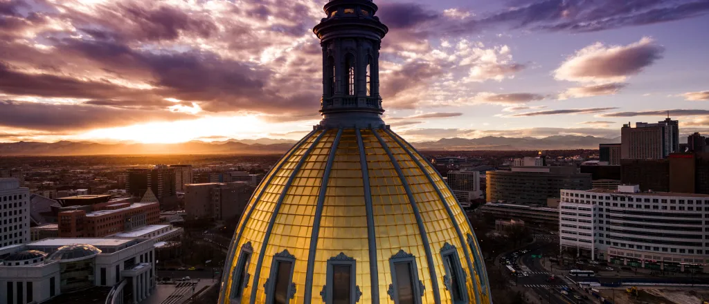 PROMO HIRES Government - Colorado Capitol Building Dome Sky Clouds - iStock - nick1803 Aerial view of the Colorado capitol building dome with clouds at sunset.