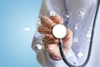 PROMO HIRES Health - Medical Stethoscope Symbols - iStock - Natali_Mis Person holding a stethoscope receiver toward the camera with images of medical symbols
